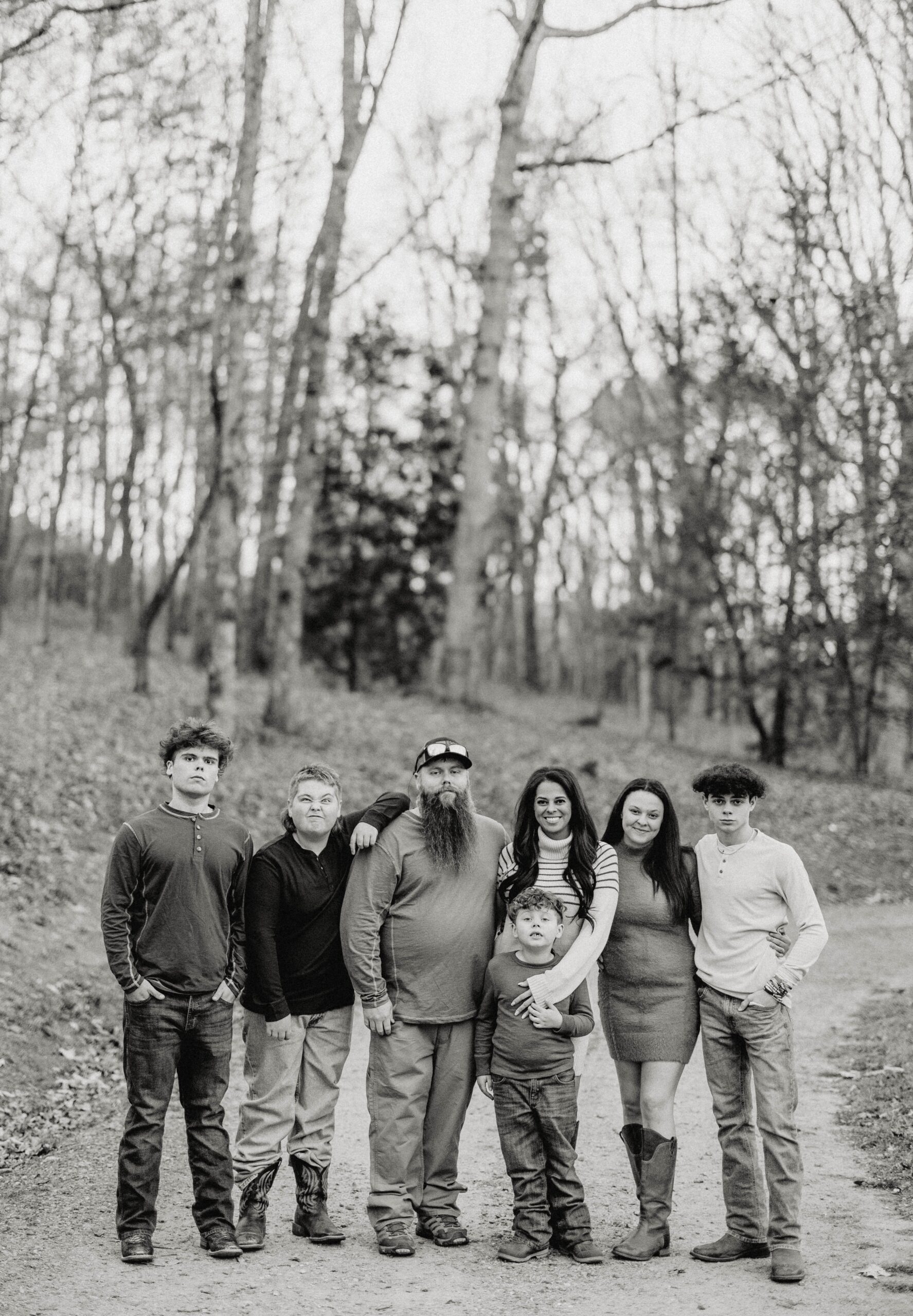 Family standing together outdoors, representing unity, resilience, blended family love, and a legacy built through commitment and perseverance